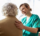 Nurse holding patient's back