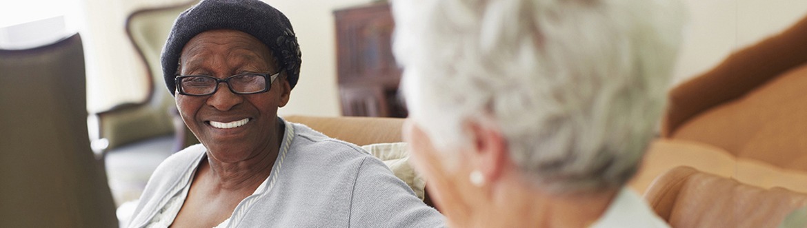 Senior residents chatting on the couch